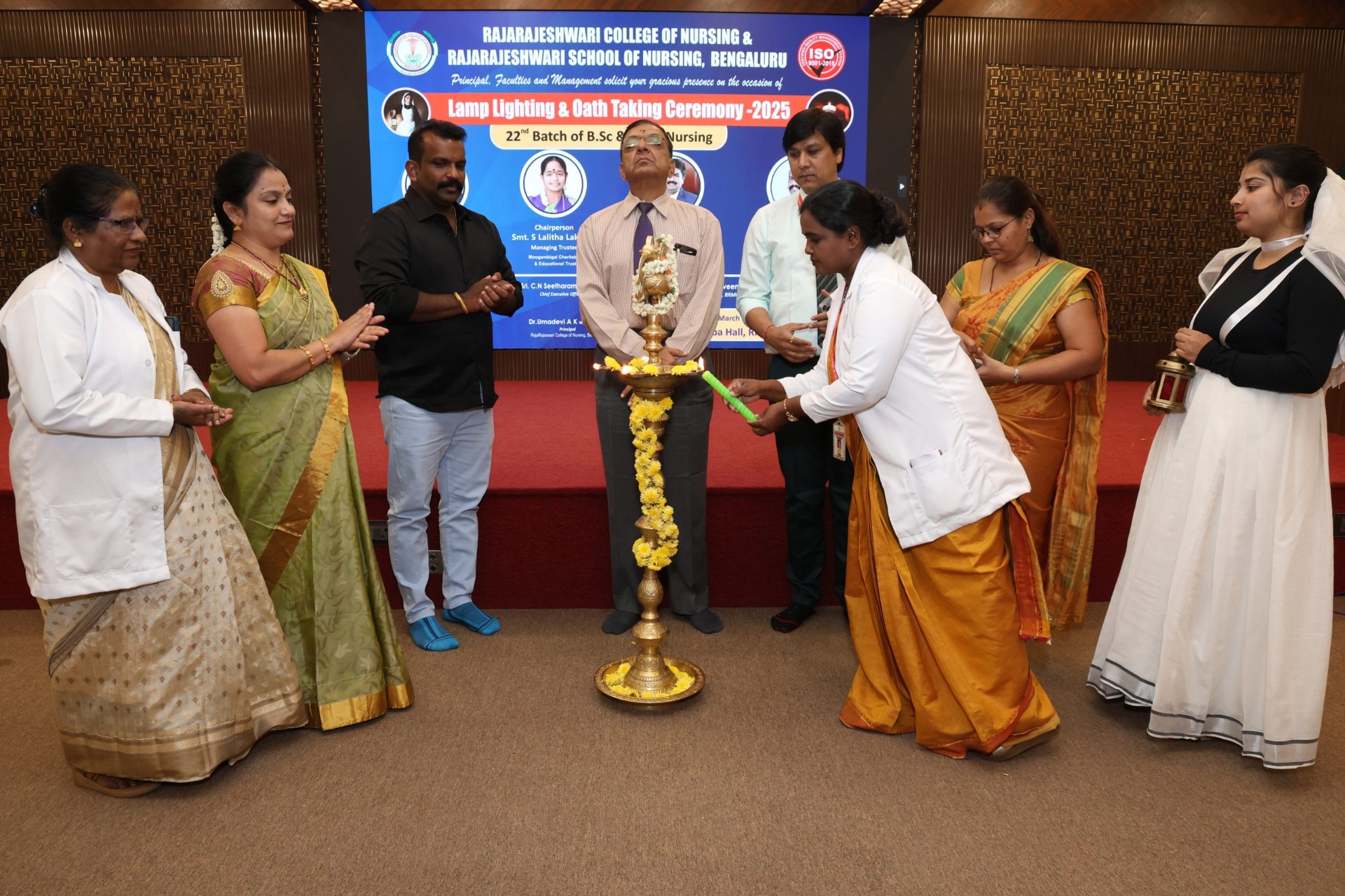 Lighting the lamp with faculty and dignitaries